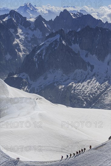 Climber on glacier in front of mountains, group, Mont Blanc massif, Chamonix, French Alps, France, Europe