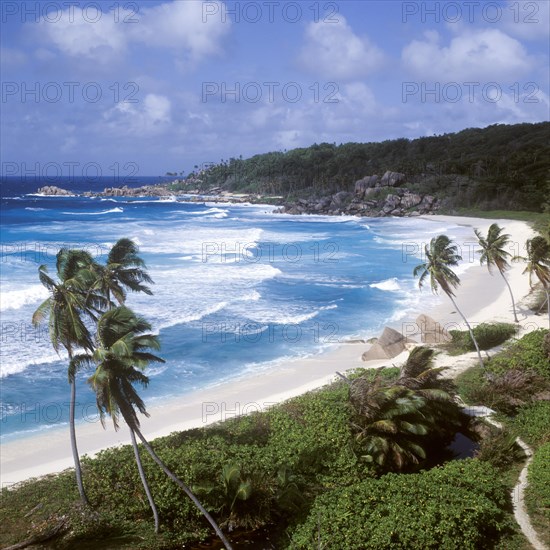 Waves in a storm on La Digue at Grand Anse beach, Seychelles, Africa