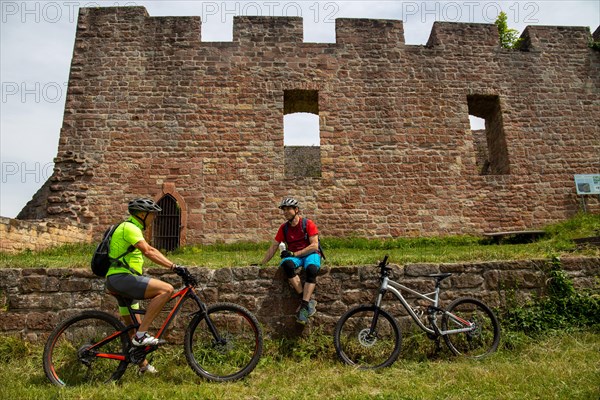 Mountain bikers take a break at the Wolfsburg above Neustadt in the Palatinate Forest, Germany, Europe