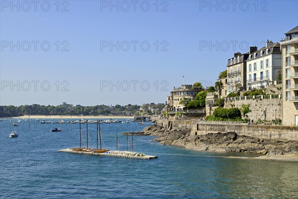 Fortified coastline with buildings on the rocky shore in Dinard, Ille-et-Vilaine, Brittany, France, Europe