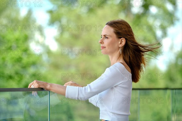 Cute woman looking at the cityscape