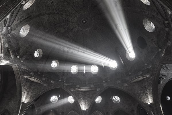 Beams of light illuminate the interior of St Jacob's Church, Enschede, Netherlands