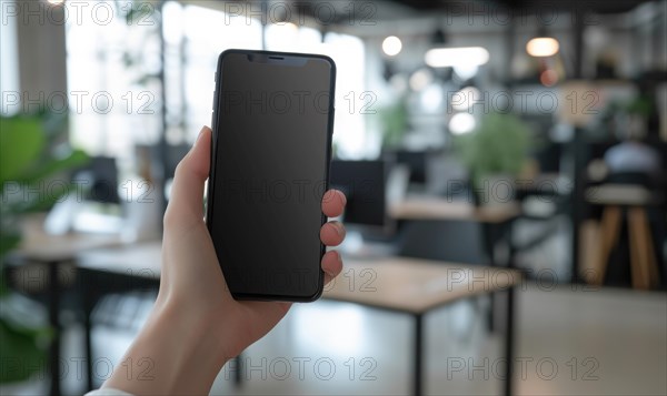 Woman hand holding smart phone with blank screen in coffee shop blur background AI generated