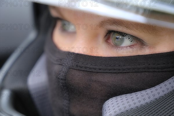 Racer with helmet and balaclava