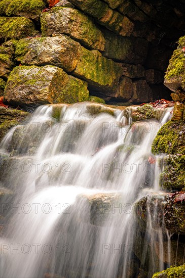 Waterfall in the Rautal forest in Jena in winter, Jena, Thuringia, Germany, Europe