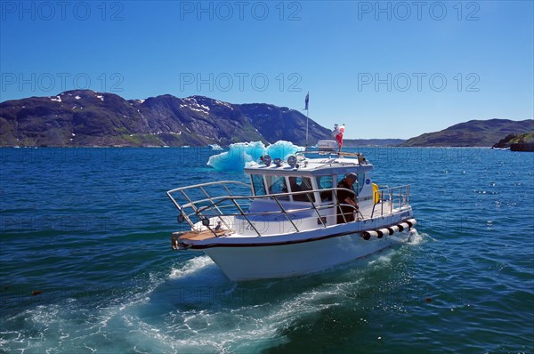 Small boat in a fjord, rough mountains, icebergs, Igaliku, Greenland, Denmark, North America