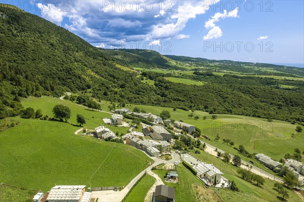 Farmhouses and pastures on Lessinia Plateau aeriel view Sant'Anna d'Alfaedo Italy
