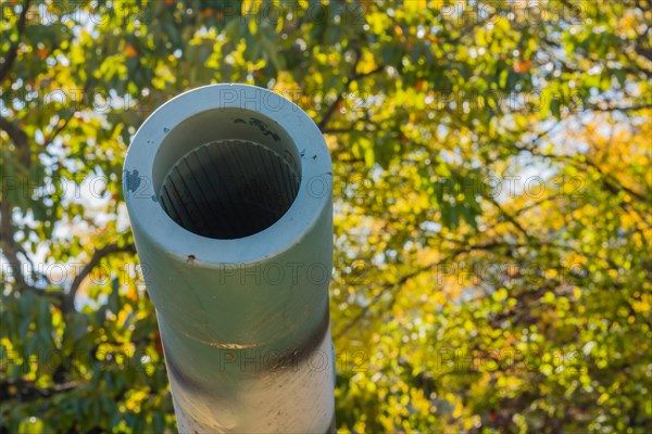 Closeup of muzzle of military artillery weapon on display at public park