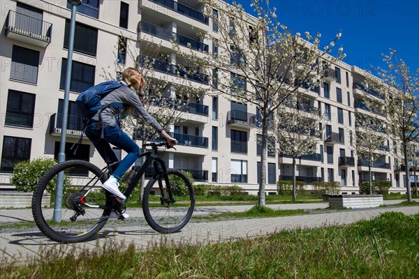 Young woman with bicycle in the city