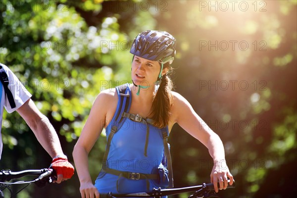 Close-up of an attractive and sporty female mountain biker