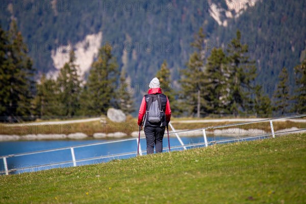 Woman hiking at the Kaltwassersee lake in Seefeld, Tyrol