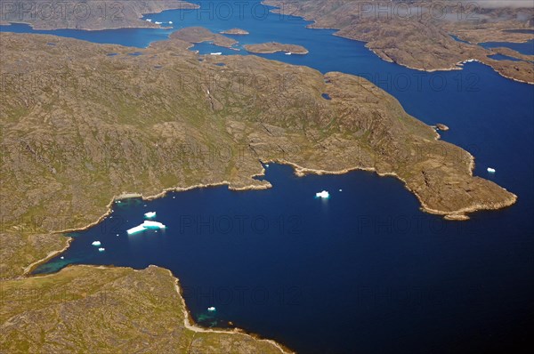 Iceberg, ice and islands, in a fjord, aerial view, rough, snow-covered rough mountain landscape, aerial view, South Greenland, Nanortalik, North America, Greenland, Denmark, North America