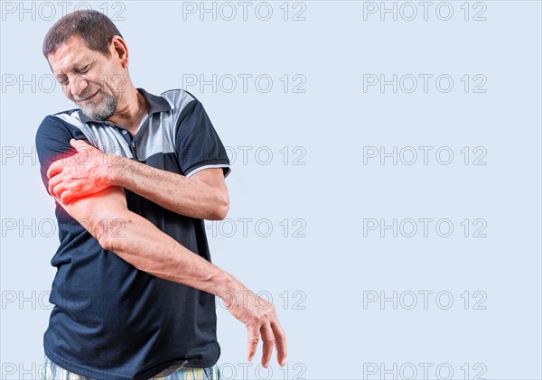 Senior man with arm pain isolated. Elderly person suffering with arm pain