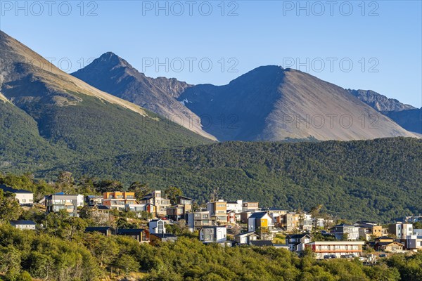 Houses in the city of Ushuaia against the backdrop of the mountains of Tierra del Fuego, Tierra del Fuego Island, Patagonia, Argentina, South America