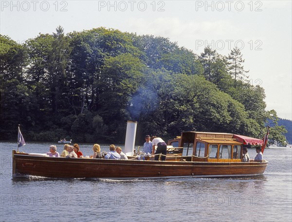 Steamboat transports tourists on Lake Windermer in the Lake District, Great Britain, Europe. Scanned 6x6 slide