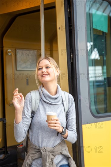 Young woman boarding a train