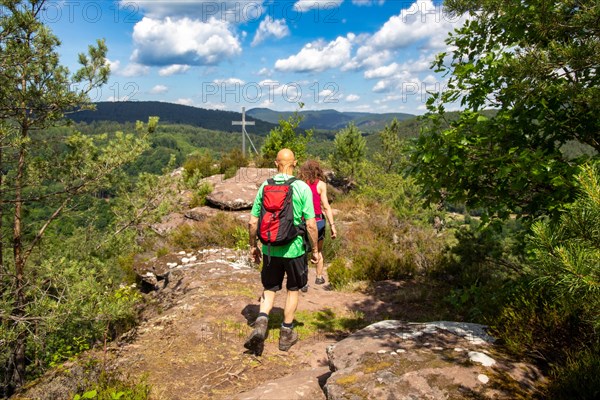 Hikers at the summit of the Hockerstein in the Palatinate Forest