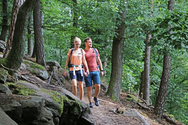 Symbolic image: Young couple hiking in the Palatinate Forest, here on the fifth stage of the Palatinate Wine Trail between Neustadt an der Weinstrasse and St. Martin