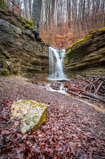 The waterfall in the Rautal forest at Burschenplatz in winter, Jena, Thuringia, Germany, Europe