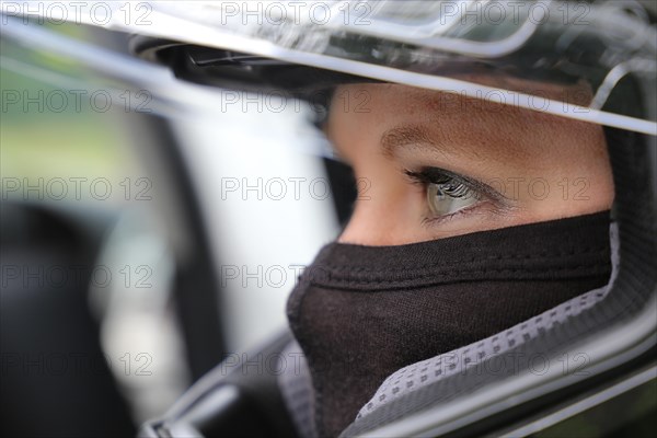 Racer with helmet and balaclava