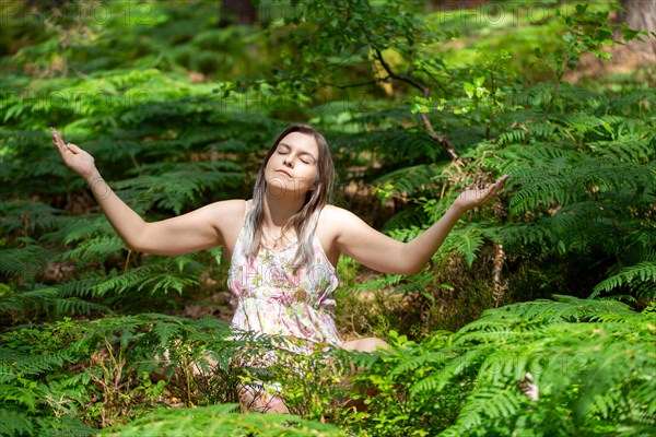 Young woman bathing in the forest (Shinrin Yoku), nature therapy from Japan