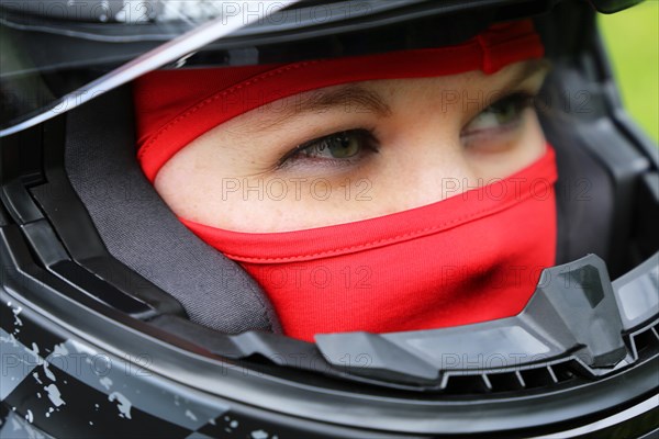 Symbolic image: Racer with helmet and balaclava