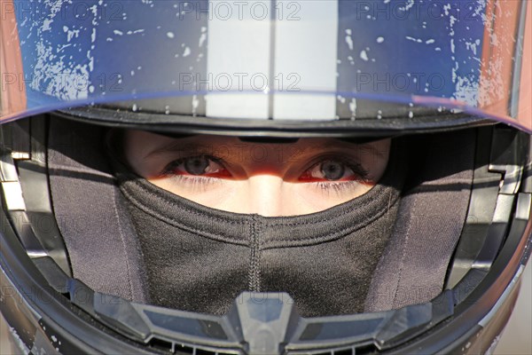 Racer with helmet and balaclava