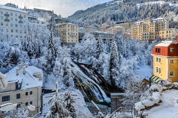 Winter village centre with waterfall of the Gasteiner Ache, Bad Gastein, Gastein Valley, Hohe Tauern National Park, Salzburg Province, Austria, Europe