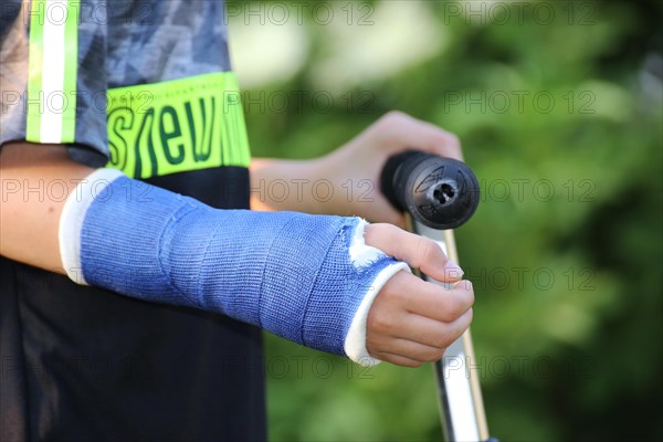 Close-up of a boy with an arm in plaster