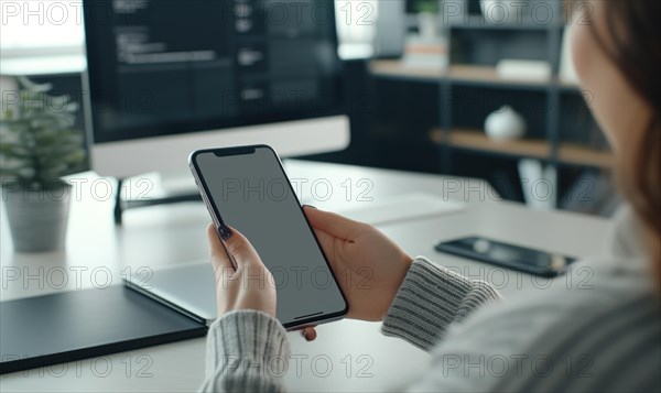 Woman using smartphone with blank screen at table in office, closeup AI generated