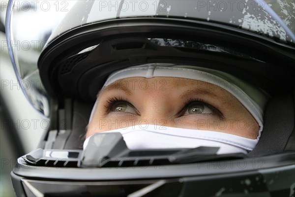 Racer with helmet and balaclava