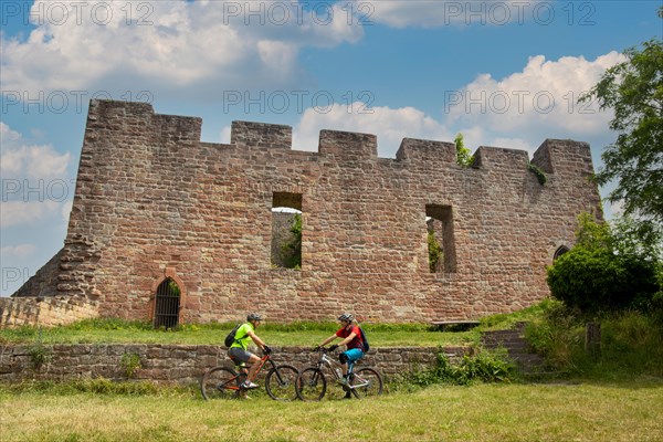 Mountain bikers take a break at the Wolfsburg above Neustadt in the Palatinate Forest, Germany, Europe