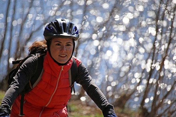 Close-up of an attractive and sporty female mountain biker