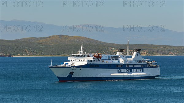 Large white ferry on blue sea with clear sky, en route to a destination, Gythio, Mani, Peloponnese, Greece, Europe