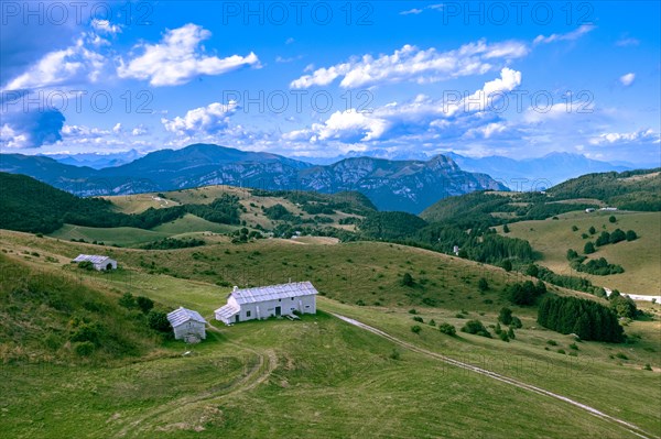 Farmhouses and pastures on Lessinia Plateau From Passo Fittanze Di Sega