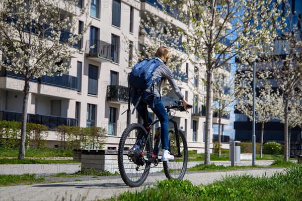 Young woman with bicycle in the city