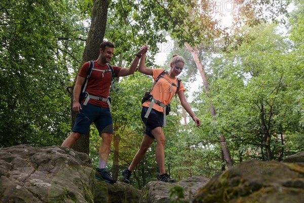 Symbolic image: Young couple hiking in the Palatinate Forest, here on the fifth stage of the Palatinate Wine Trail between Neustadt an der Weinstrasse and St. Martin