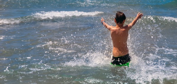 Boy has fun in the sea