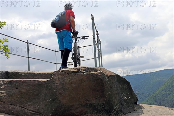 Mountain biker enjoys the view of the Palatinate Forest above Neustadt an der Weinstrasse