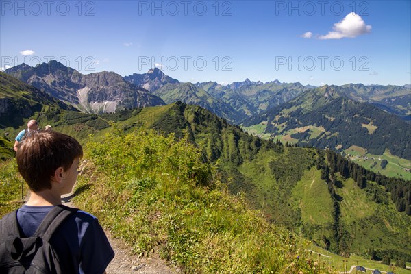 Hiking in the Allgaeu Alps: Boy hiking in the Kanzelwand area (Kleinwalsertal, Austria)