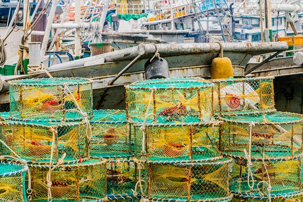Closeup of large yellow and blue crab cages used to bait, lure, and catch crabs for commercial or recreational use in South Korea