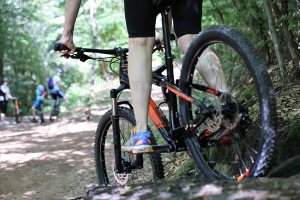 Close-up of a mountain biker in difficult terrain