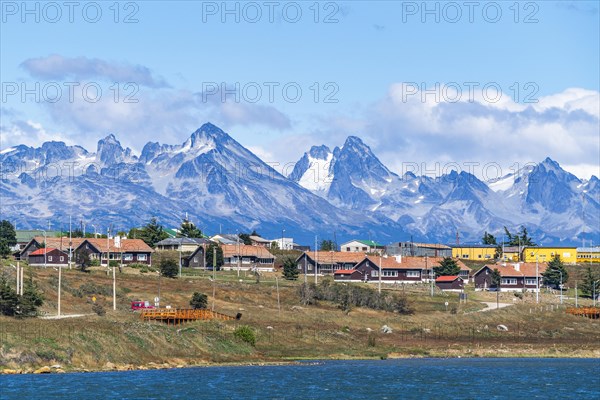 Architecture in the city of Ushuaia, behind the mountains of the island Hoste Chile, island Tierra del Fuego, Patagonia, Argentina, South America