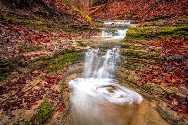 Waterfall in the Rautal forest in Jena in winter, Jena, Thuringia, Germany, Europe