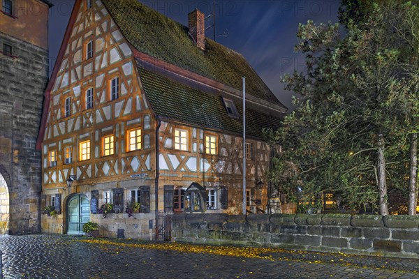 Historic half-timbered house from 1799, in the old town at night in autumn rain, Lauf an der Pegnitz, Middle Franconia, Bavaria, Germany, Europe