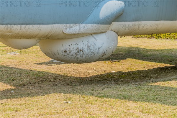 Starboard view of sensor dome on bottom of military tracker aircraft on display in public park