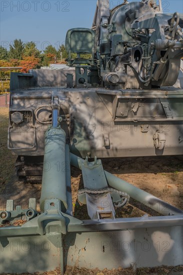 Hydraulic recoil spade on rear of armored military vehicle on display in public park