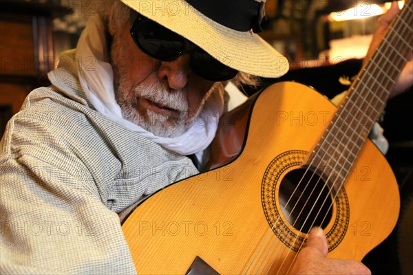 Guitar player, musician plays the guitar