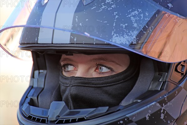 Racer with helmet and balaclava