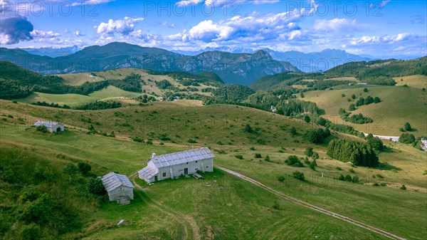 From Passo Fittanze Di Sega farmhouses and pastures on Lessinia Plateau